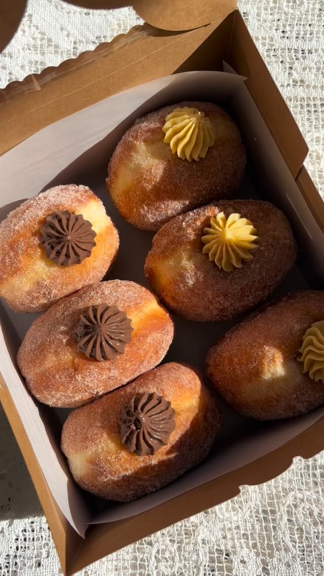 Brioche donuts dusted in sugar, fresh from the cottage bakery